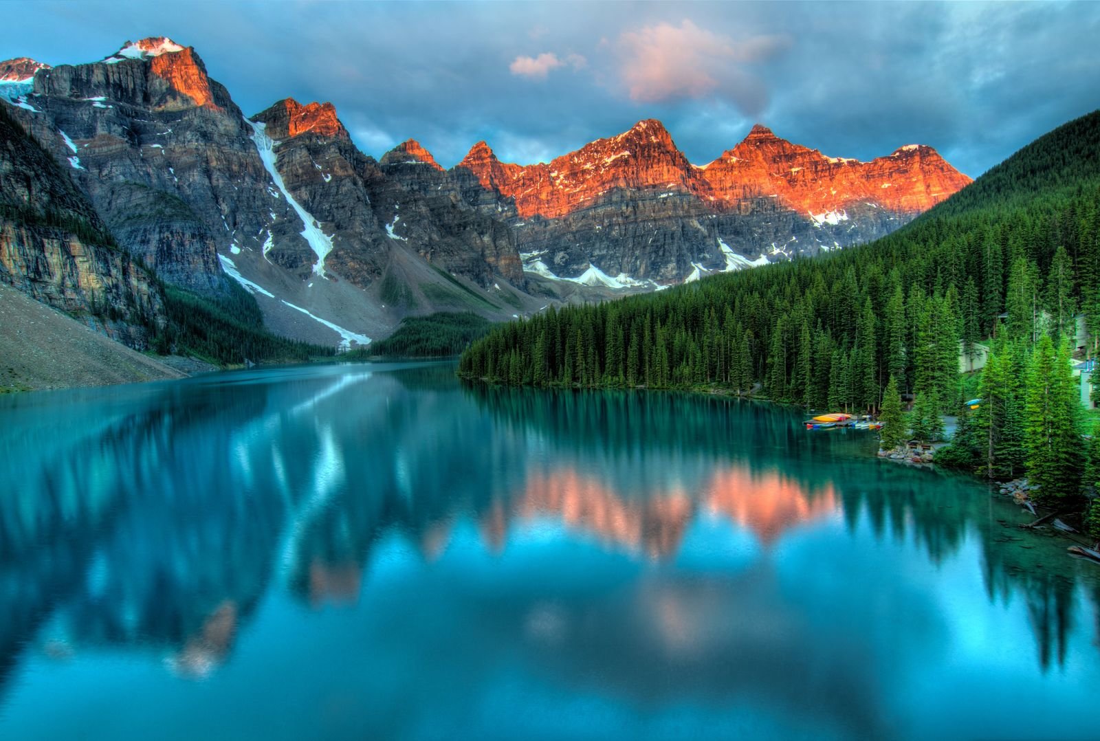 Alpine lake in the Colorado Rockies glowing under alpenglow at sunset